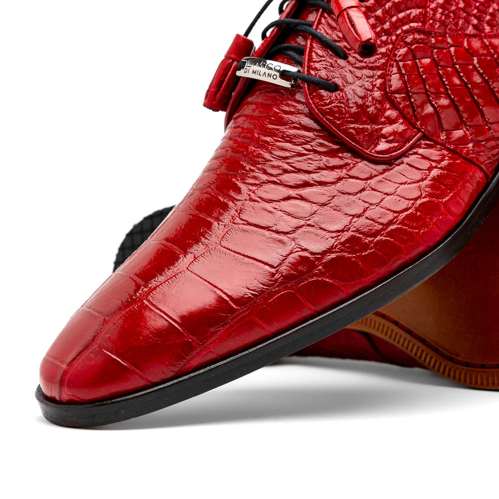 The Marco Di Milano Fitipaldi Red features luxury handmade men's shoes in red crocodile-pattern leather with black laces and brown soles—one shoe upright, the other propped beneath.
