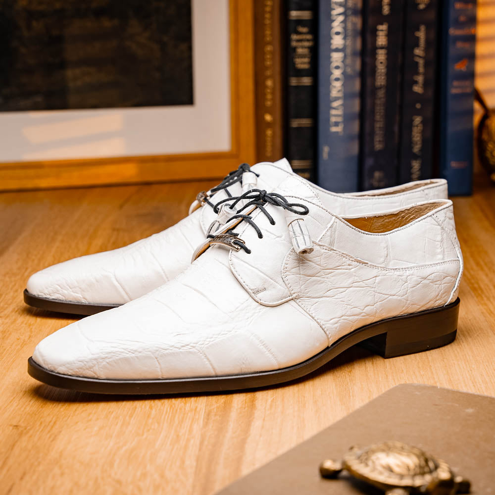 The Fitipaldi White by Marco Di Milano is a luxury men's dress shoe in white leather with black laces and an orange-brown sole, featuring the brand's signature style—ideal for those seeking standout footwear.