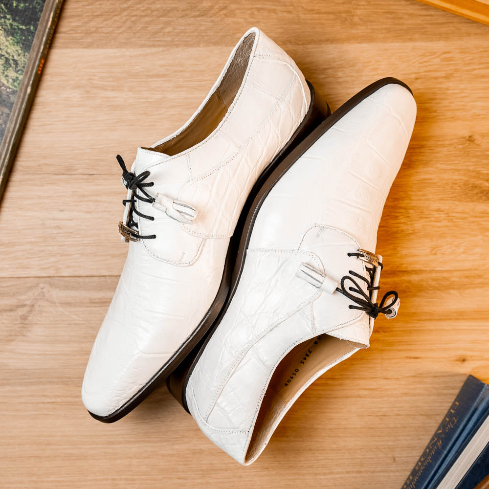 The Fitipaldi White by Marco Di Milano is a luxury men's dress shoe in white leather with black laces and an orange-brown sole, featuring the brand's signature style—ideal for those seeking standout footwear.