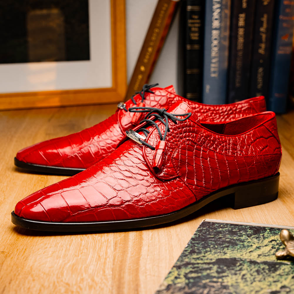 The Marco Di Milano Fitipaldi Red features luxury handmade men's shoes in red crocodile-pattern leather with black laces and brown soles—one shoe upright, the other propped beneath.