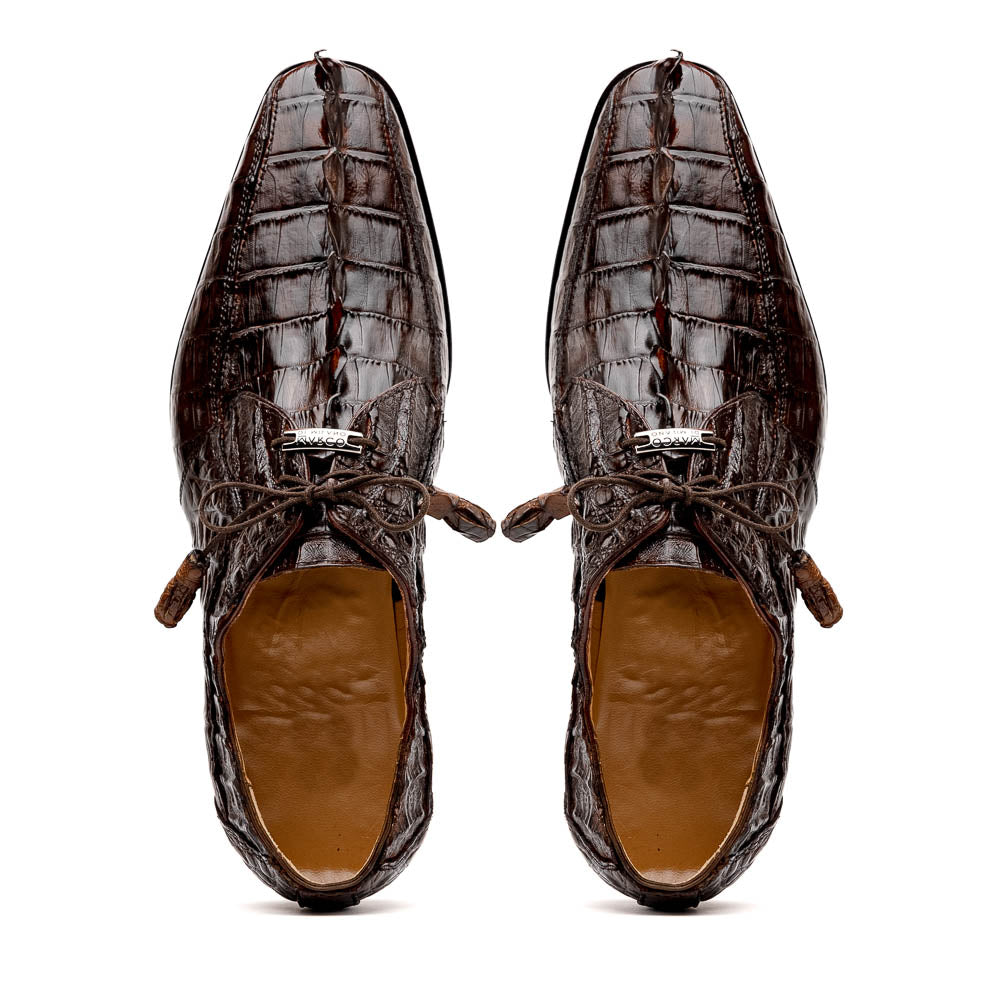 A pair of Marco Di Milano Cancun Brown derby shoes in dark brown hornback caiman crocodile leather—one displays the textured upper, while the other reveals the hand-painted exotic sole embossed with the brand.