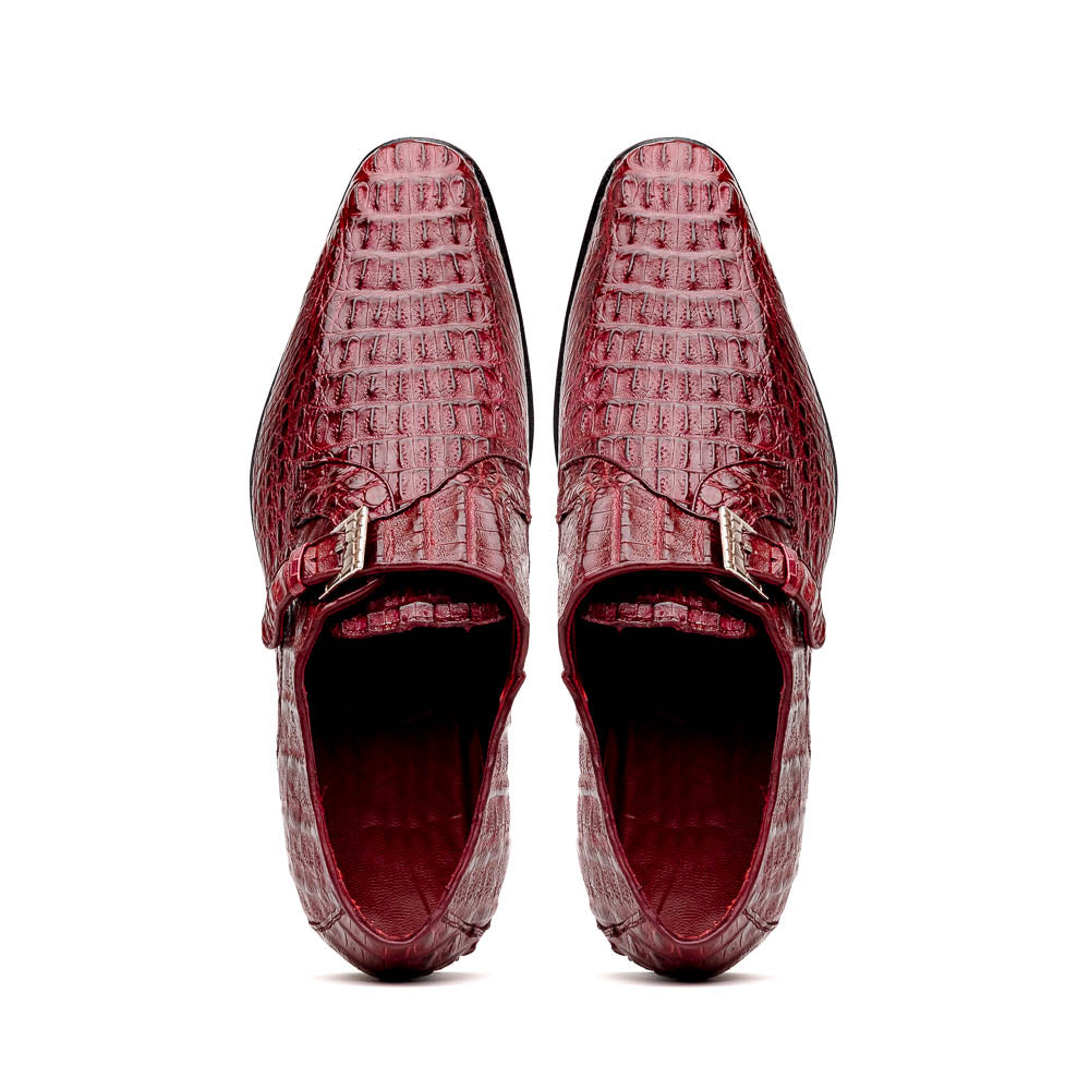 A pair of Luigi Wine monk strap dress shoes by Marco Di Milano, crafted in burgundy crocodile-pattern leather with silver buckles—one shoe displays the sole featuring the Marco Di Milano branding.