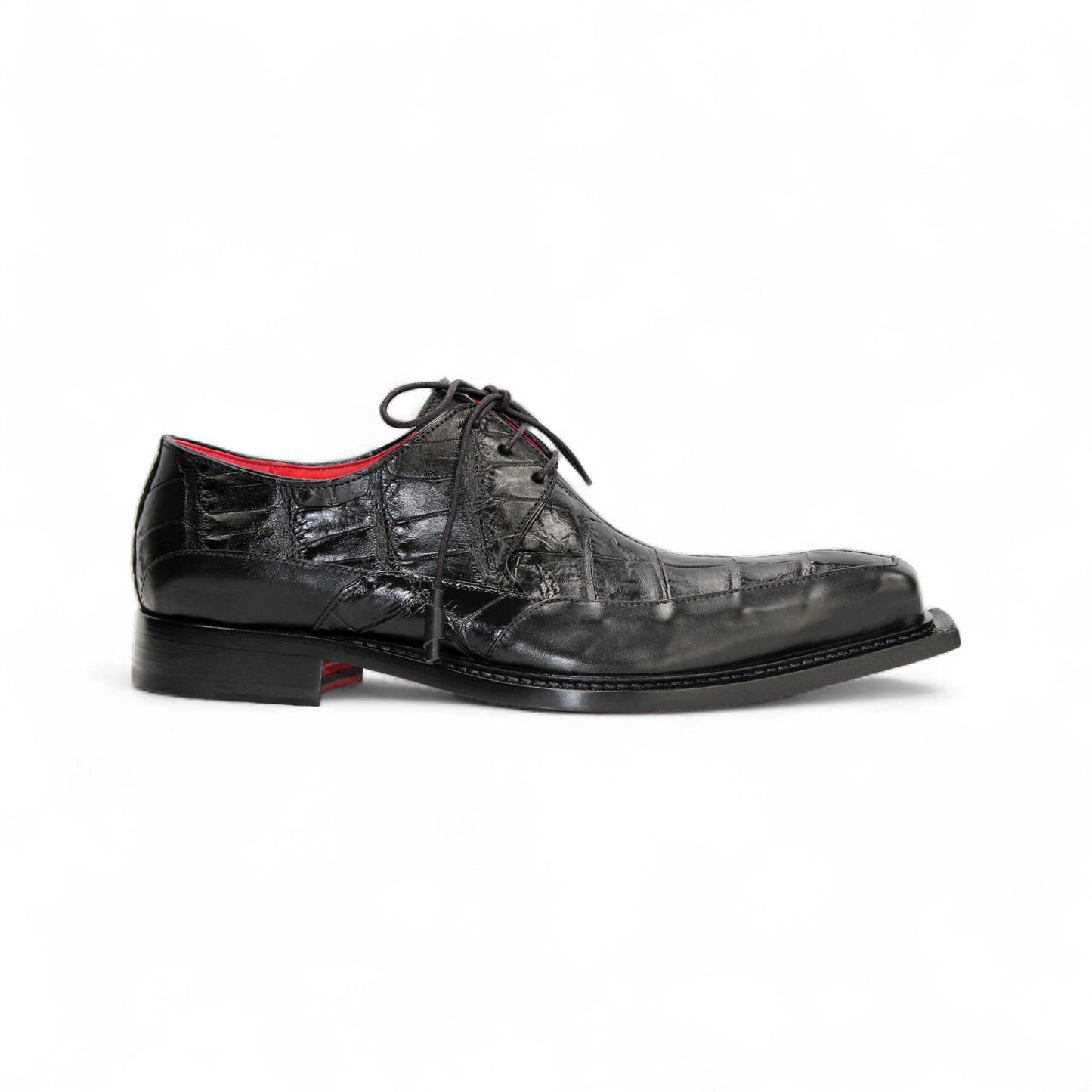 The Fennix Frank Black by Fennix of Italy is a men's black leather dress shoe with a crocodile texture, lace-up closure, red lining, and a squared toe—luxury footwear designed to make a statement.
