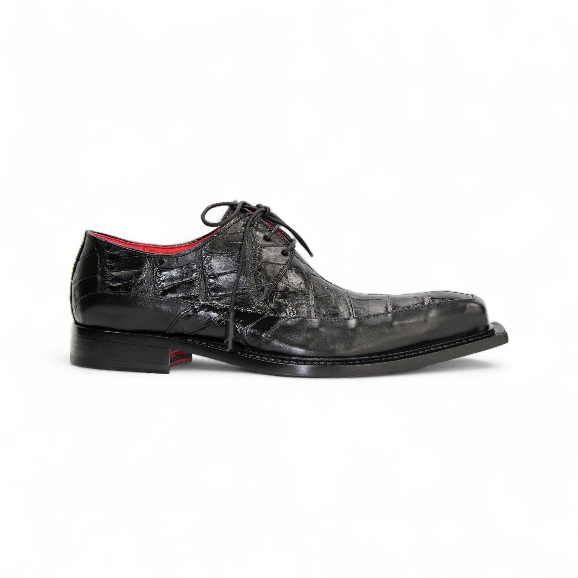 The Fennix Frank Black by Fennix of Italy is a men's black leather dress shoe with a crocodile texture, lace-up closure, red lining, and a squared toe—luxury footwear designed to make a statement.