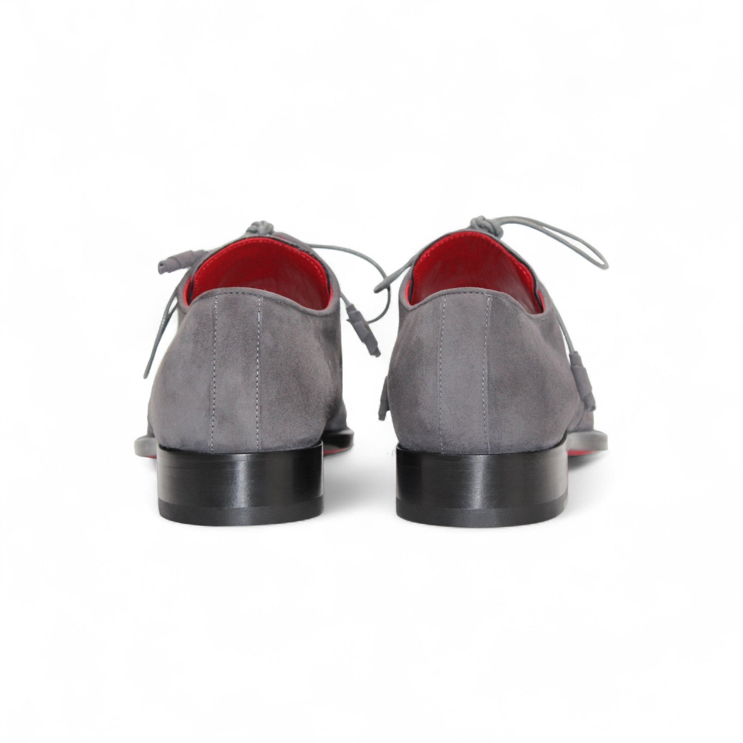 The Emilio Franco Gabriele Grey is an Italian suede lace-up dress shoe in grey, featuring a black leather sole and red interior, shown in side profile on a white background for timeless style.