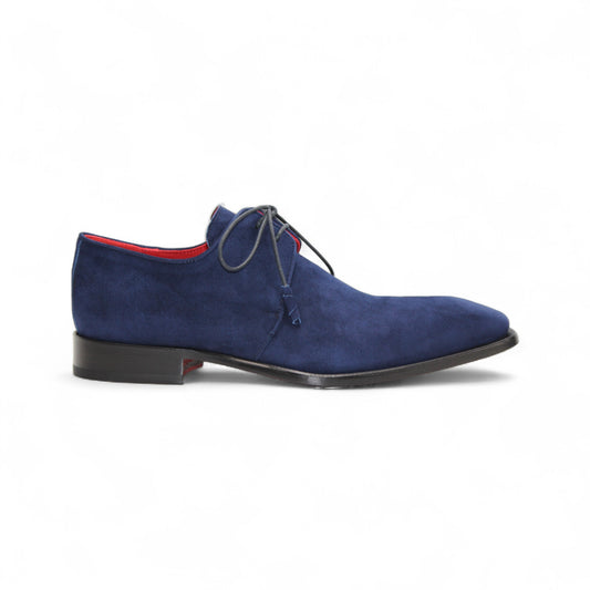 The Emilio Franco Gabriele Navy men’s dress shoe features dark blue Italian suede, laces, a black leather sole, and a red inner lining, shown in profile on a white background.