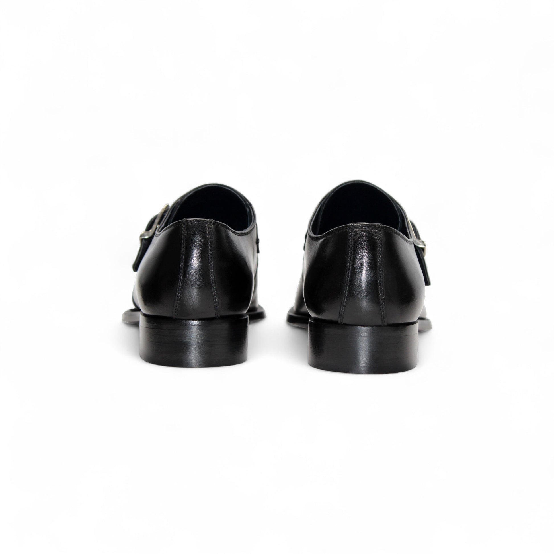 The Duca Di Matiste Duca Garda Black is a genuine black leather dress shoe with a single side buckle and low heel, ideal for the modern wardrobe, shown against a white background.