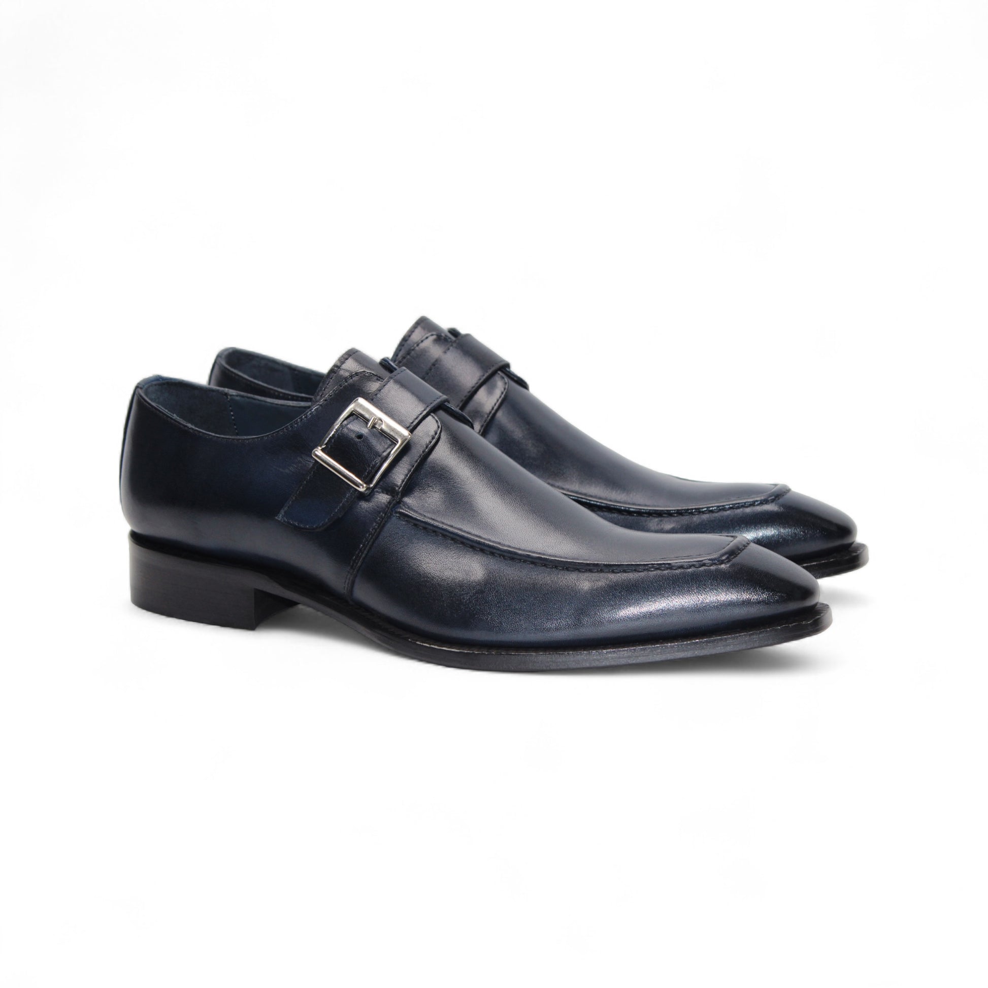The Duca Di Matiste Duca Garda Navy is a handcrafted Italian leather shoe in dark blue, featuring a side buckle, low heel, and pointed toe, shown against a white background.