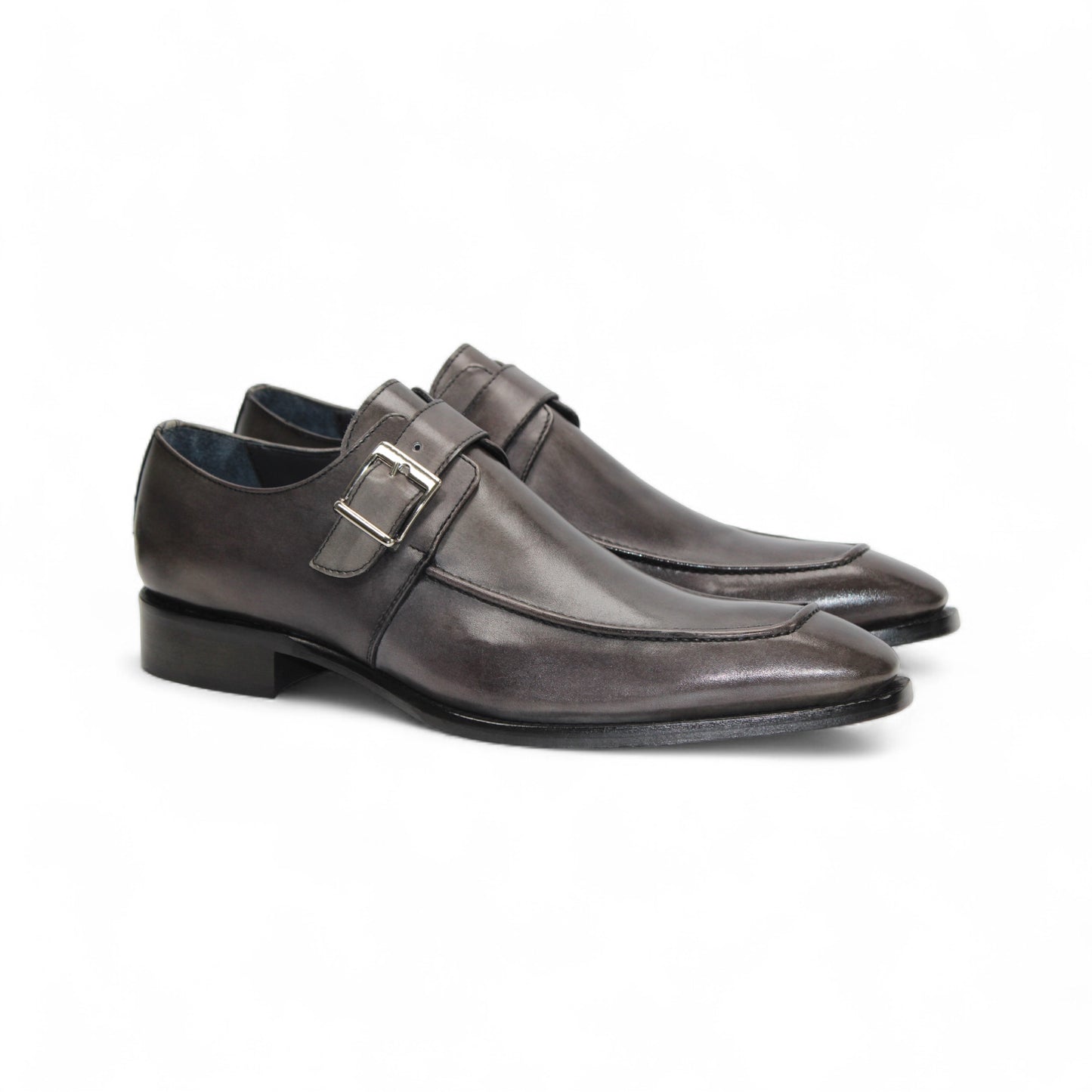 The Duca Di Matiste Duca Garda Grey—a genuine leather dress shoe with pointed toe, low heel, and side buckle—is an elegant choice for any modern wardrobe, shown here in gray on a white background.