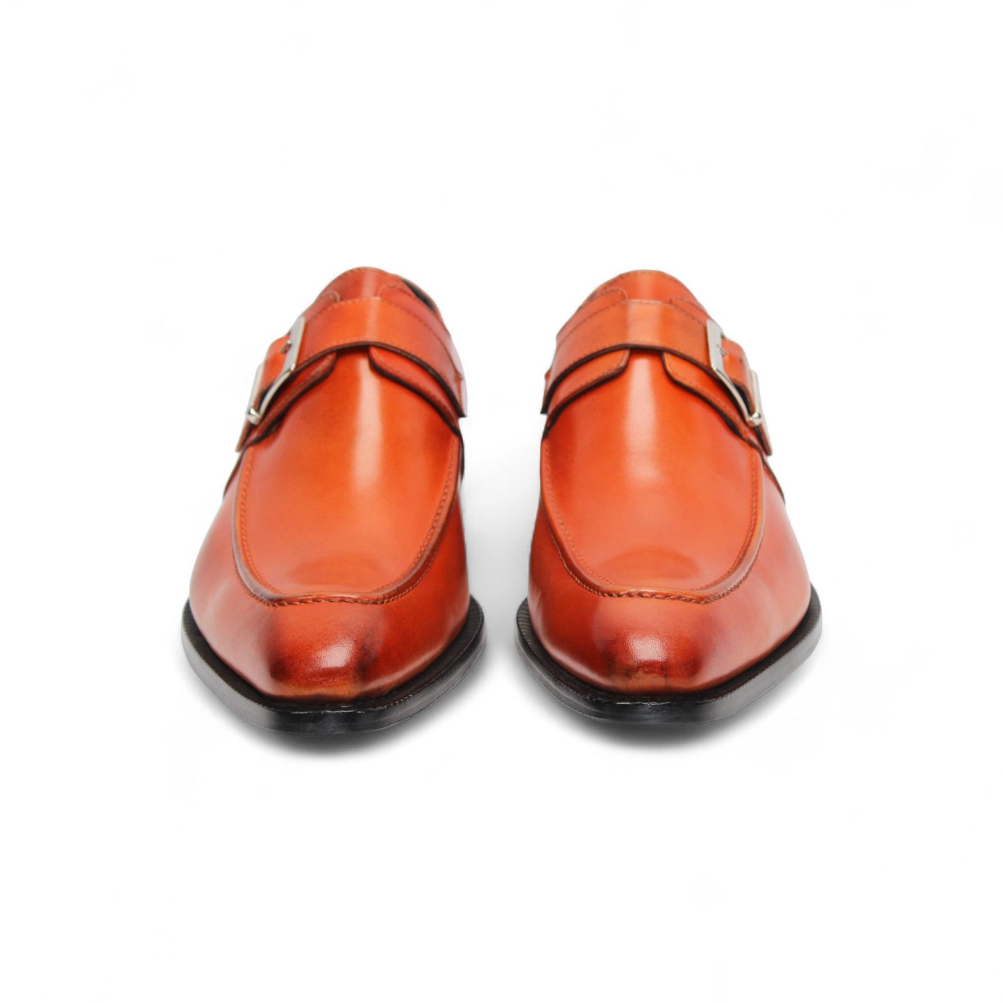 The Duca Di Matiste Duca Garda Orange dress shoe, crafted from genuine leather with a side buckle and low black heel, is shown in profile on a white background—a refined, modern wardrobe addition.