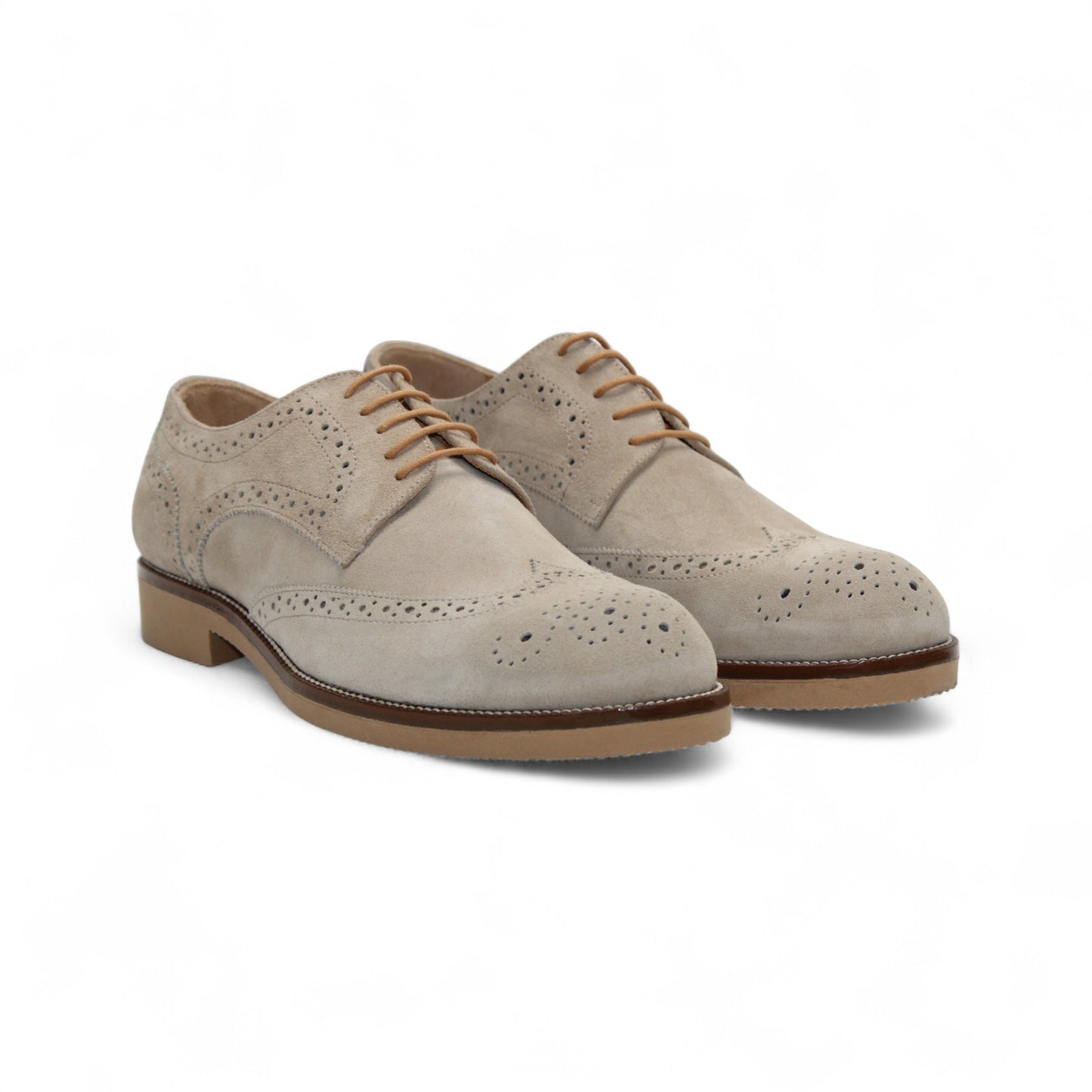The Firmani George Beige is an Italian suede Oxford shoe with brogue detailing, brown laces, and a comfy rubber sole by Firmani, shown in side profile on a white background.