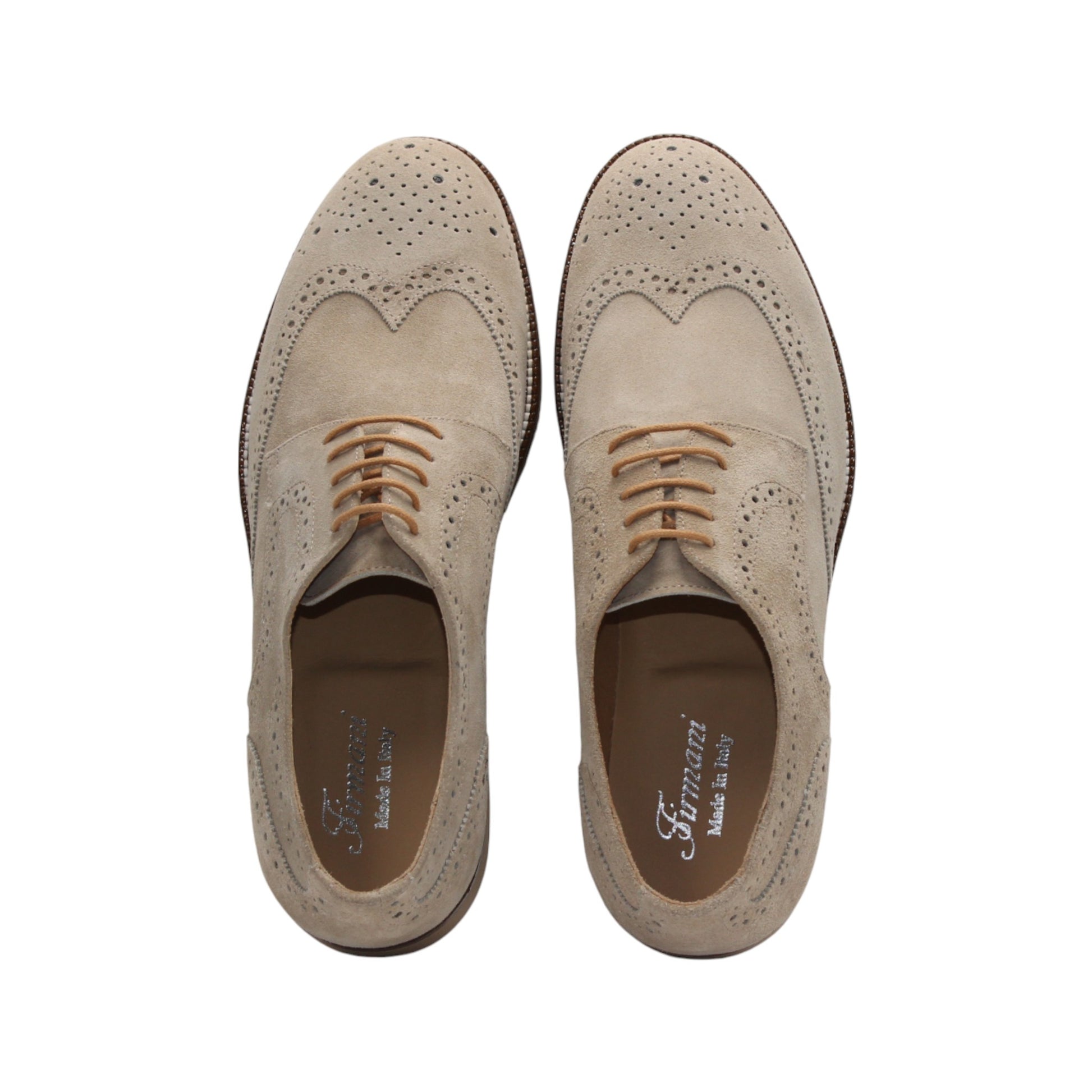 The Firmani George Beige is an Italian suede Oxford shoe with brogue detailing, brown laces, and a comfy rubber sole by Firmani, shown in side profile on a white background.