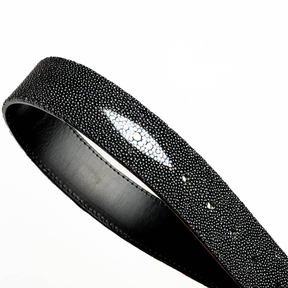 The Georgia Belt Black by Marco Di Milano is a luxury men's belt made from genuine stingray skin, featuring a bold black texture and a large gold "MD" buckle.