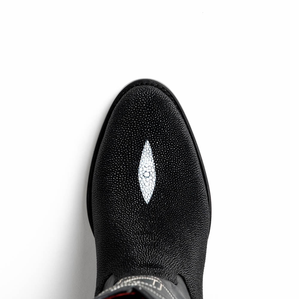 A pair of Georgia Black handcrafted western boots by Marco Di Milano, featuring white stitching—one boot upright and the other on its side displaying the branded sole.