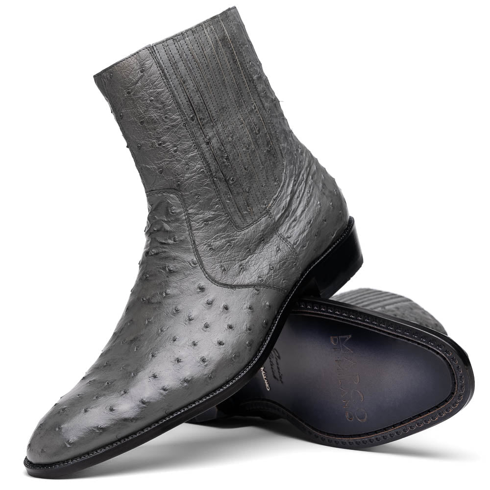 The Giorgio Serpentine Gray boots by Marco Di Milano—crafted from genuine ostrich quill leather—feature one upright and one on its side to reveal the sole, highlighting luxurious materials and exceptional craftsmanship.