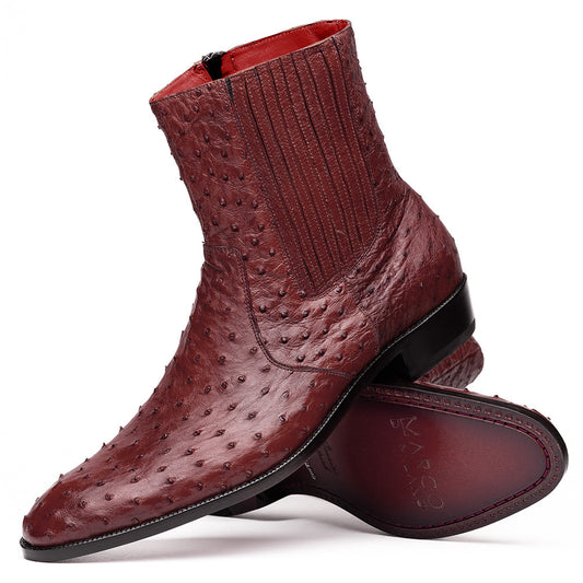 Introducing Giorgio Wine by Marco Di Milano: a pair of luxurious men's boots handcrafted in genuine burgundy ostrich leather, featuring a distinctive textured pattern, side zipper, elastic panel, and a sleek black sole—sophisticatedly presented against a white background.