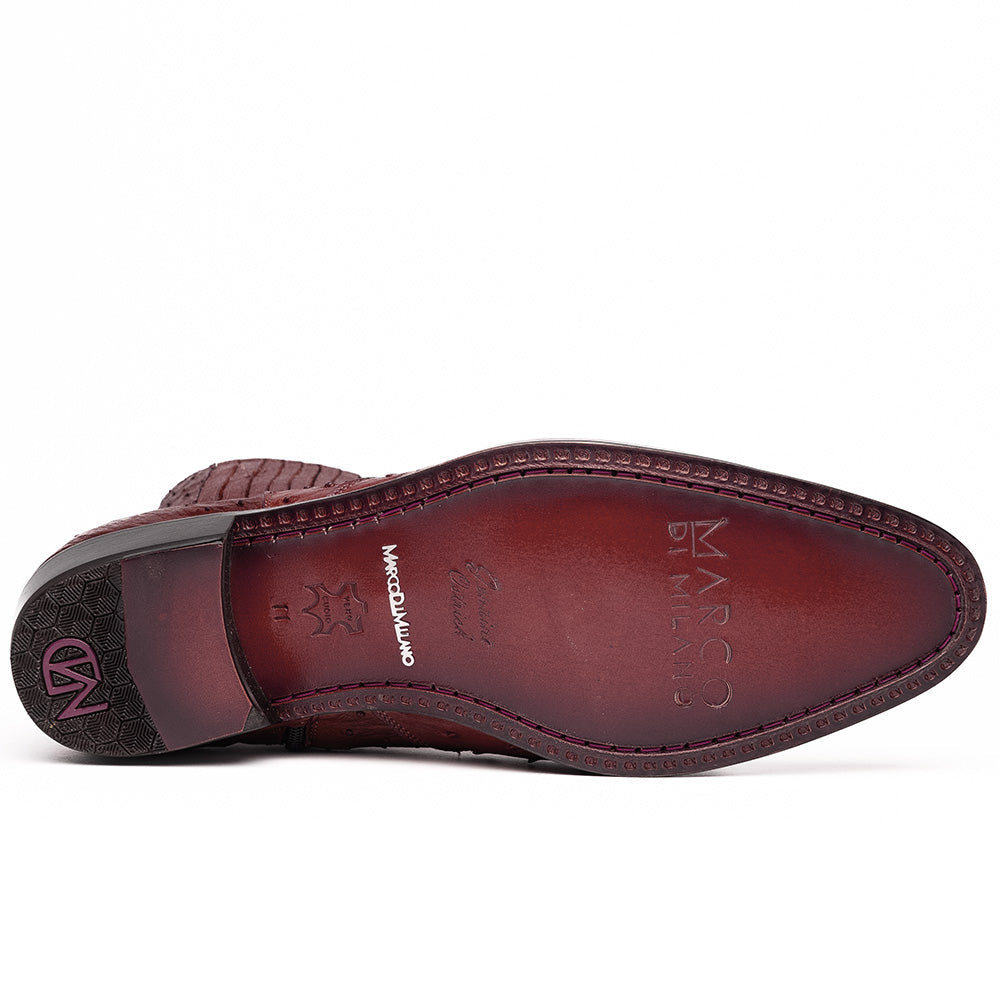 Introducing Giorgio Wine by Marco Di Milano: a pair of luxurious men's boots handcrafted in genuine burgundy ostrich leather, featuring a distinctive textured pattern, side zipper, elastic panel, and a sleek black sole—sophisticatedly presented against a white background.