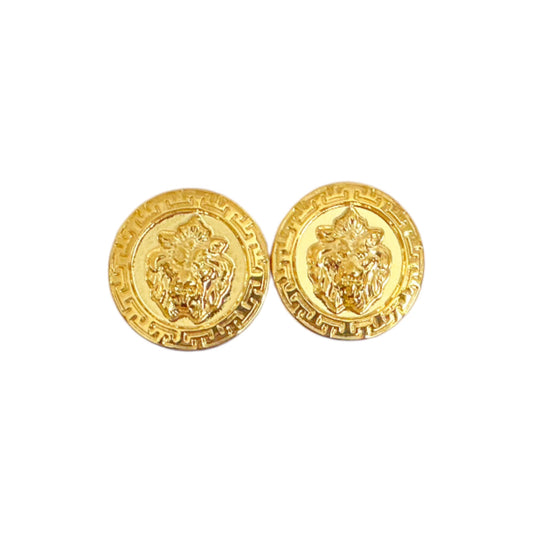 Matiste Gold Cufflinks by Matiste feature two round gold pieces with raised lion head designs and decorative borders, displayed against a white background.