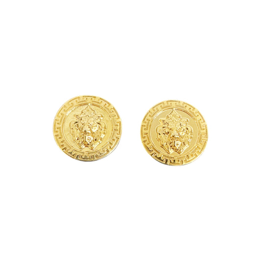 The Matiste Gold Lion Lace Bar earrings by Matiste feature a round, gold-toned design with a raised lion head and decorative border, inspired by Italian luxury and iconic Lion Lace Bar style.