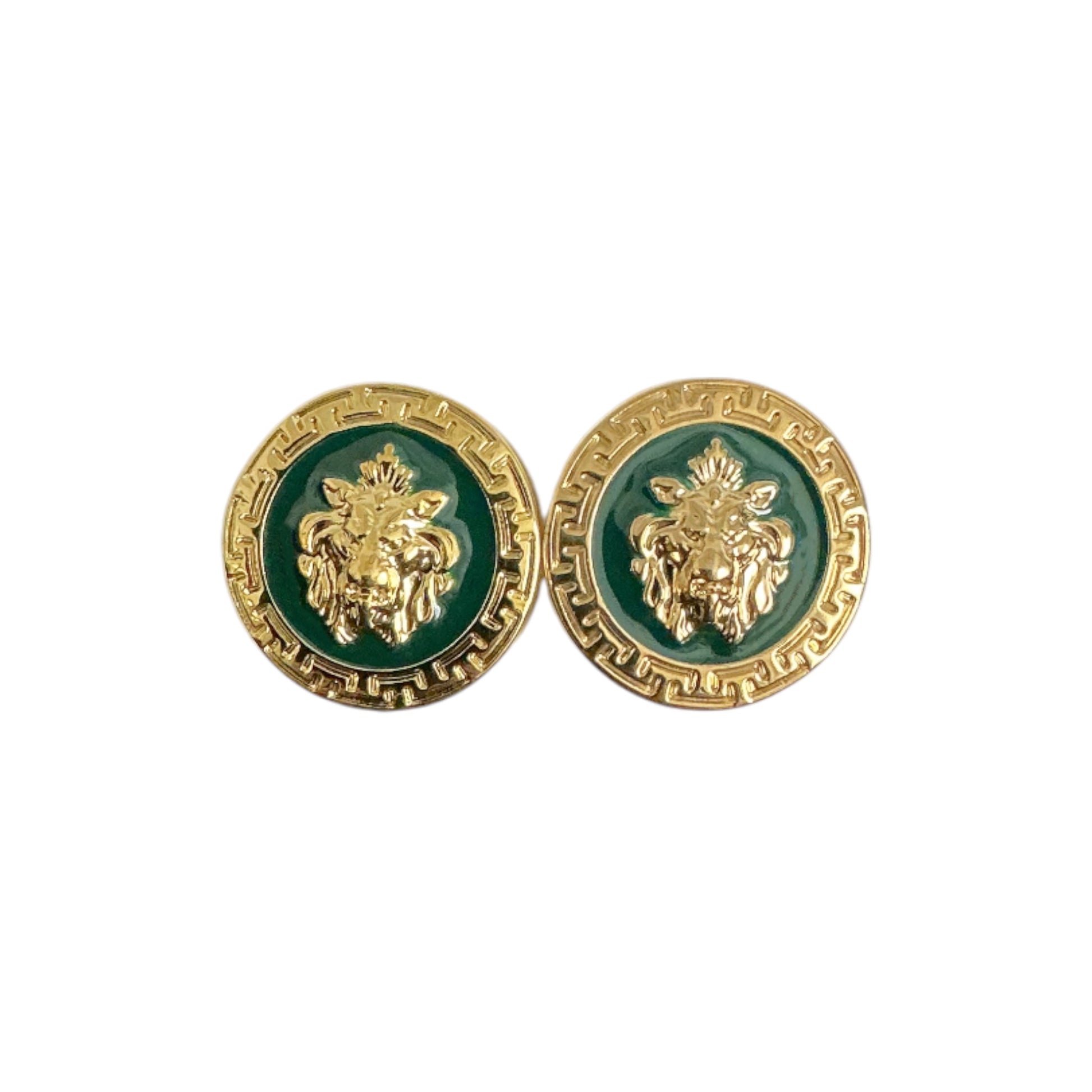 The Matiste Green/Gold Cufflinks by Matiste feature a round design with a raised lion head at the center and a patterned border, echoing the look of classic Italian accessories.