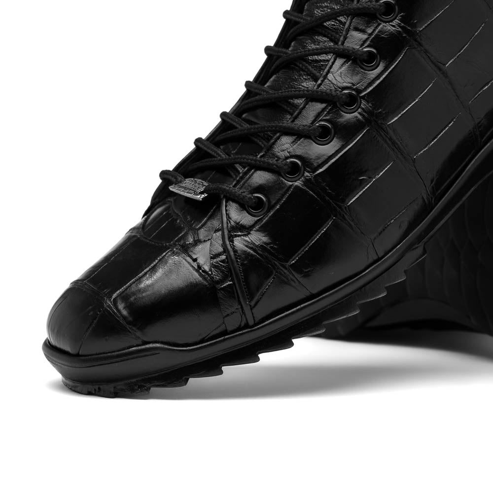 The Hermond Black boots by Marco Di Milano feature high-top, crocodile-patterned black leather and durable rubber soles—one boot stands upright while the other is propped beneath it.