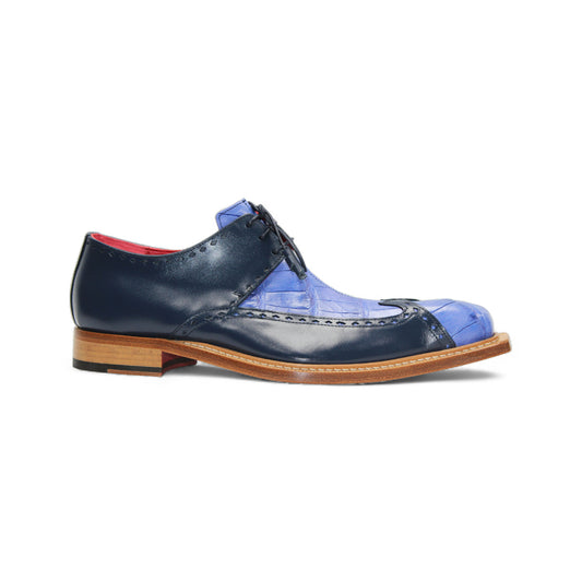 A single Fennix Harry Light Blue/Navy men’s dress shoe by Fennix of Italy, featuring a premium blue leather upper, wooden sole, black laces, and squared toe—shown in side profile to highlight Italian craftsmanship.