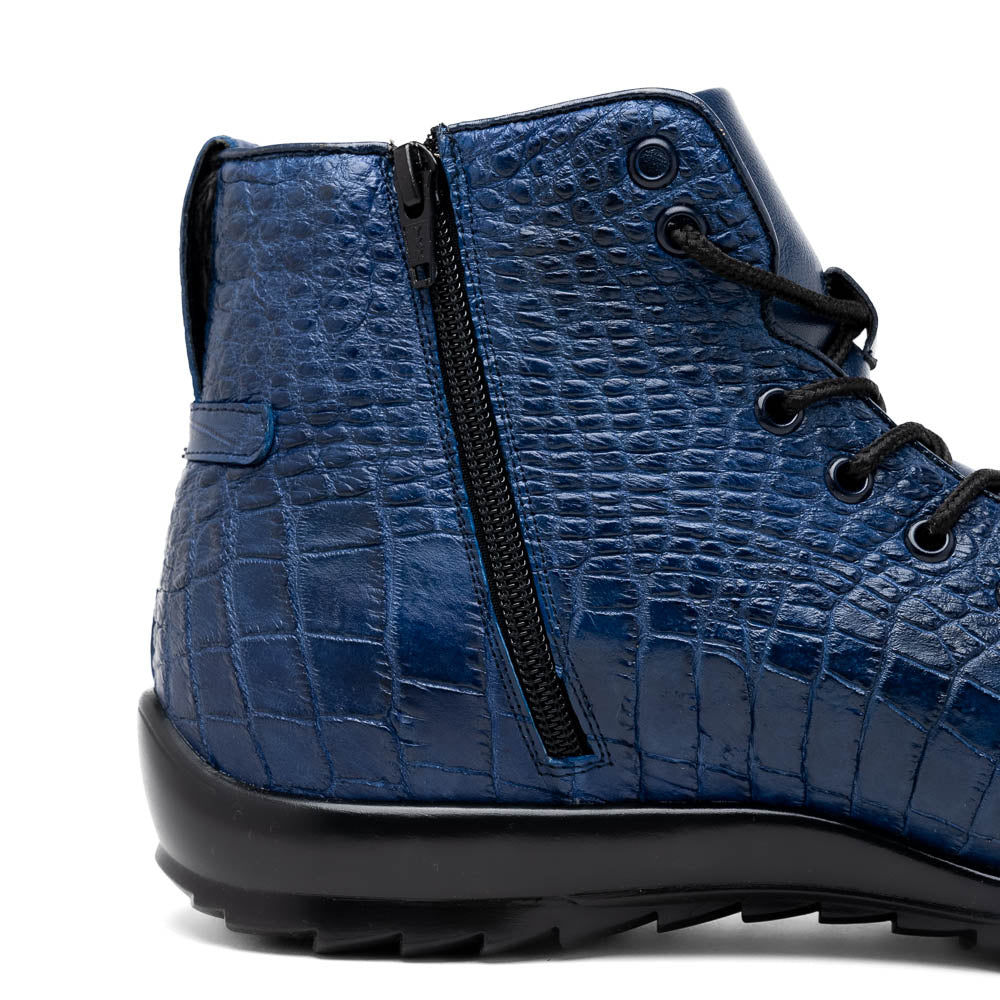 The Hermond Navy by Marco Di Milano: luxury high-top shoes in blue crocodile-patterned leather with genuine exotics, black laces, and black rubber soles—one shoe stands upright, the other lies on its side.