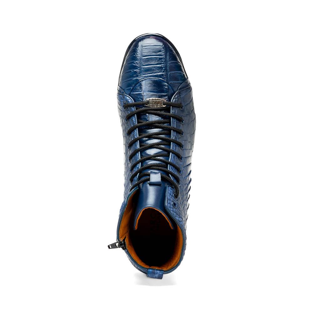 The Hermond Navy by Marco Di Milano: luxury high-top shoes in blue crocodile-patterned leather with genuine exotics, black laces, and black rubber soles—one shoe stands upright, the other lies on its side.