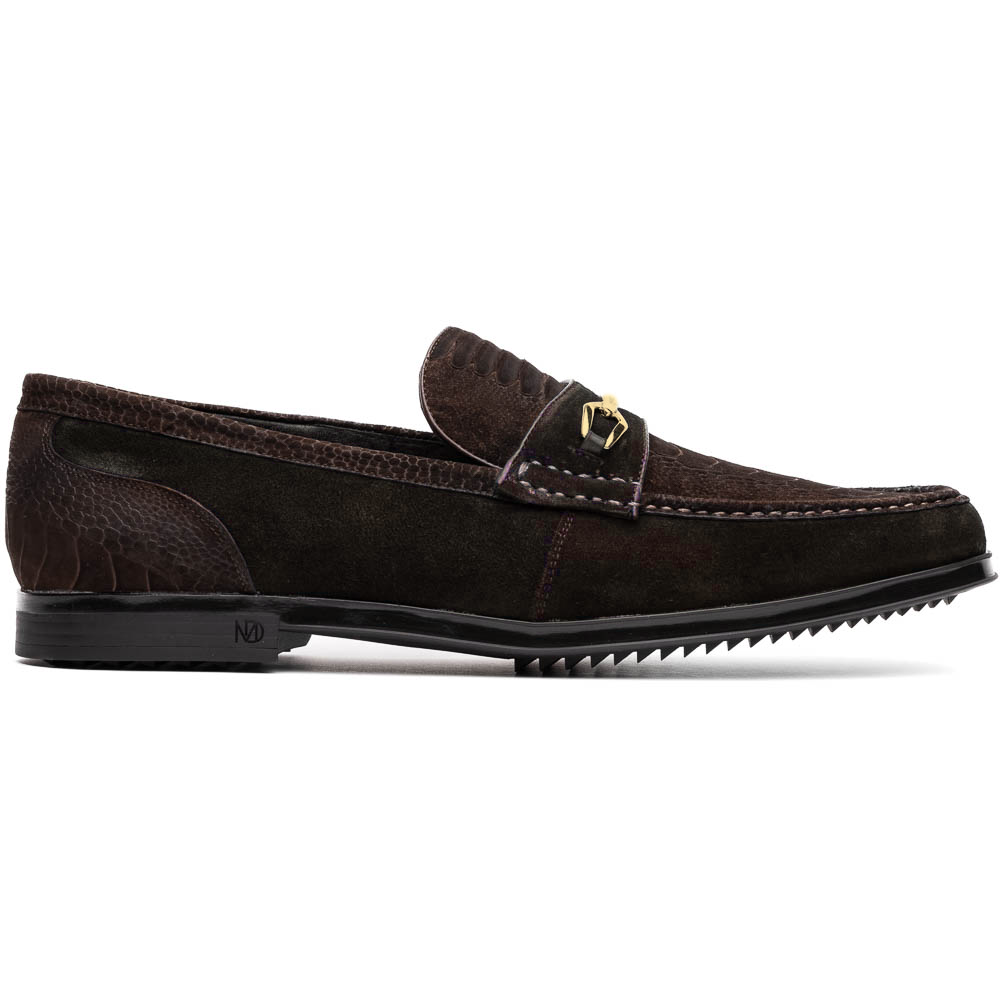A pair of Marco Di Milano Hugo Brown sueded ostrich leg loafers with gold buckle detail and textured dark brown upper—one shoe stylishly propped on the other—epitomizes luxury footwear.