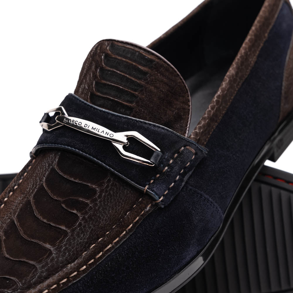 The Marco Di Milano Hugo Brown / Navy men's loafers feature dark brown textured leather, navy suede trim, a metal buckle detail, and black rubber soles for a luxurious look.