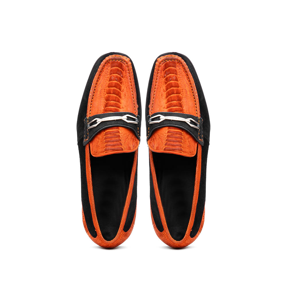 The Hugo Orange / Black by Marco Di Milano is a men's loafer with an orange crocodile-patterned upper, black suede sides, metal bit detail, and a black sole accented by red stitching—a true luxury footwear statement.