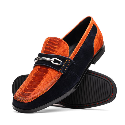 The Hugo Orange / Navy by Marco Di Milano is a men's loafer in orange crocodile-textured leather with navy suede accents, silver bit detail, and a black rubber sole with red stitching—ideal for luxury footwear fans.