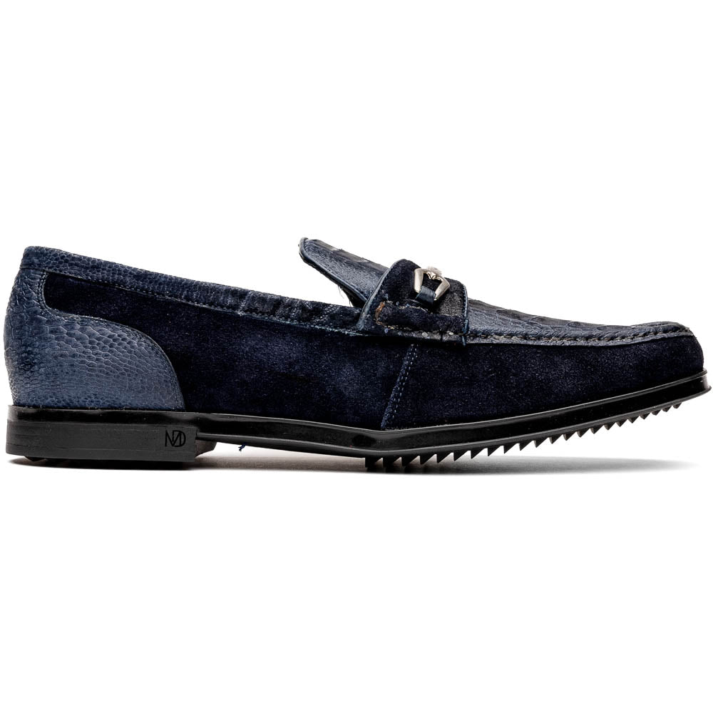 The Hugo Navy by Marco Di Milano is a pair of men's navy blue sueded ostrich leg loafers featuring a textured pattern, suede finish, and metal buckle detail—one displayed upright, the other on its side to reveal the sole.