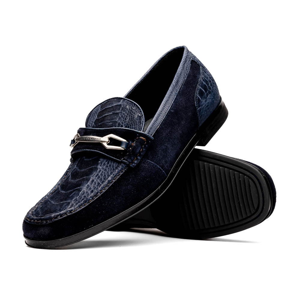 The Hugo Navy by Marco Di Milano is a pair of men's navy blue sueded ostrich leg loafers featuring a textured pattern, suede finish, and metal buckle detail—one displayed upright, the other on its side to reveal the sole.
