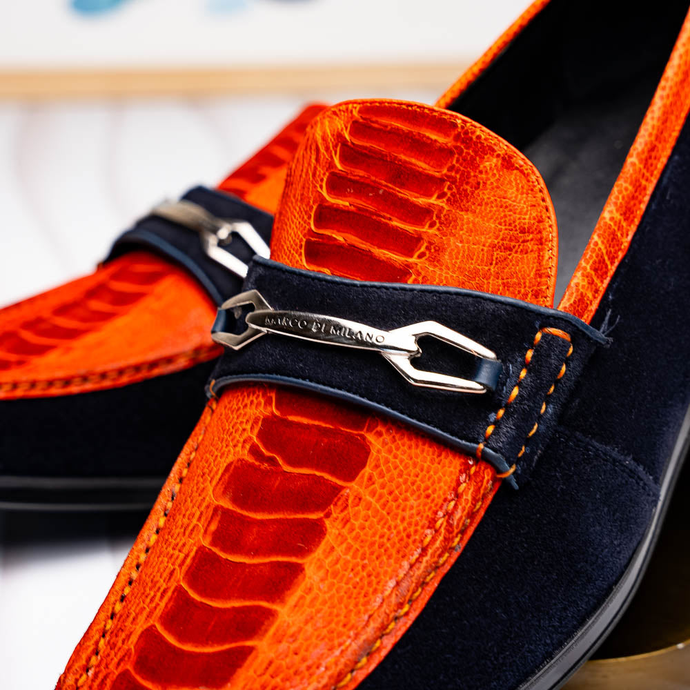 The Hugo Orange / Navy by Marco Di Milano is a men's loafer in orange crocodile-textured leather with navy suede accents, silver bit detail, and a black rubber sole with red stitching—ideal for luxury footwear fans.