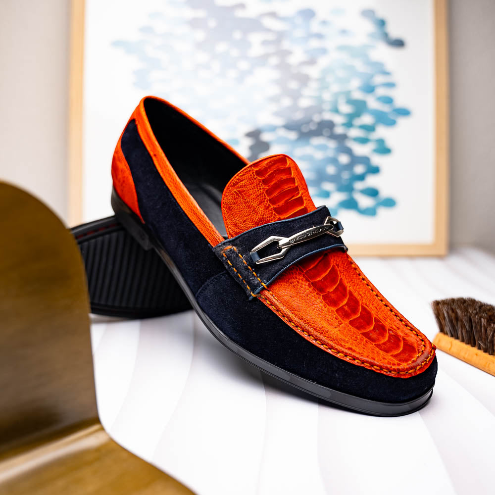 The Hugo Orange / Navy by Marco Di Milano is a men's loafer in orange crocodile-textured leather with navy suede accents, silver bit detail, and a black rubber sole with red stitching—ideal for luxury footwear fans.
