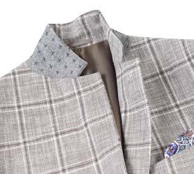 The Renoir Alessandro Vitello by Renoir New Slim Fit Sport Coat 610-9 features a gray plaid design with a single button and notch lapel. It is styled with a white shirt and striped tie, while a pocket square adds flair to the side-vented design by peeking from the chest pocket.