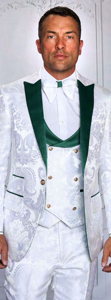 A man wears the MANZINI ARMANI 3-Piece Slim Fit Fancy Woven White Green Suit by Manzini, featuring a white paisley pattern, green lapels and accents, a white shirt, and green vest, standing against a white background.