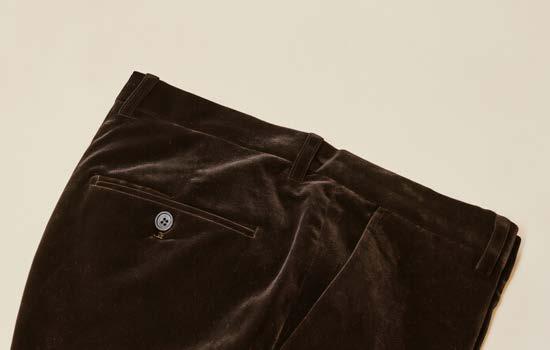 A close-up of the back and side pockets of the Inserch Velvet Pants P502-00024 in Chocolate, featuring a single buttoned back pocket and a flat front for a modern fit.