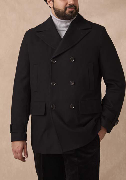 A man wearing the Inserch Wool Blend Peacoat JS558-00001 Black over a light gray turtleneck, standing against a plain beige background.