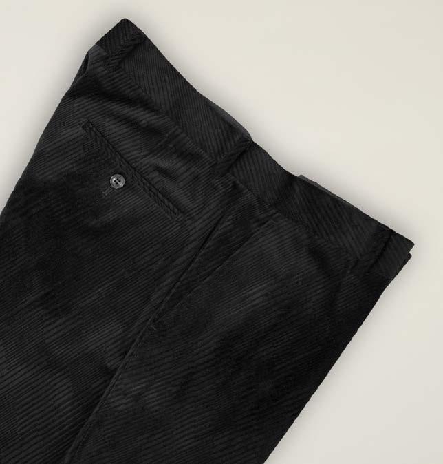 Folded pair of Inserch Velvet Diagonal Pants P275-00001 Black, featuring a single back pocket with button, displayed on a neutral background—the ideal choice for those seeking the refined texture of velvet embossed chino in a classic Inserch silhouette.