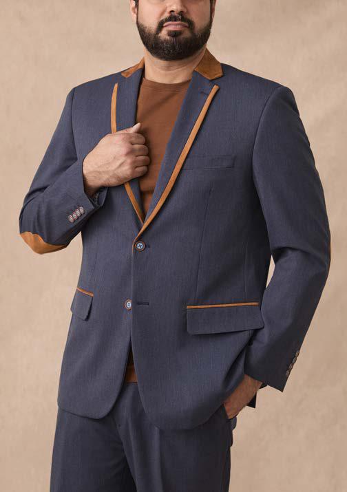 A man wearing the Inserch Denim Blazer BL274-00010 in denim blue, standing against a plain beige background.