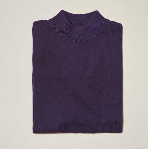 An Inserch Cotton Blend Mock Neck Sweater in purple (style 4308-00126) is folded and laid flat on a light-colored surface, showcasing its soft cotton-acrylic blend fabric.