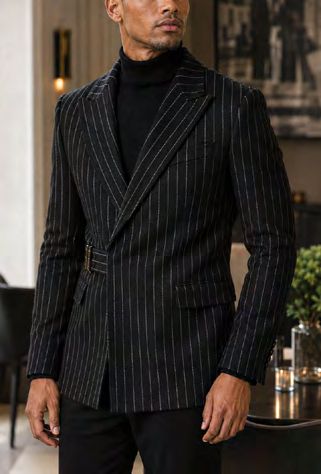 A man wearing a MANZINI MZW-702 Men’s Pinstripe Blazer Coat w/ Hook Belt Black over a black turtleneck.