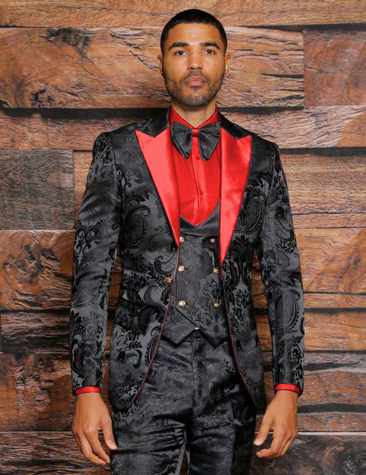 An individual clad in the INSOMNIA ARMANI Slim Fit Black Red Fancy Woven Suit from Insomnia, accessorized with a bow tie, poses against a wooden backdrop.
