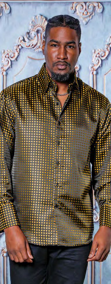 A man stands against an ornate blue and gold background, wearing the Manzini MANZINI MZT-164 Small Polka Dot Gold Long Sleeve Satin Shirt with cuff and link.