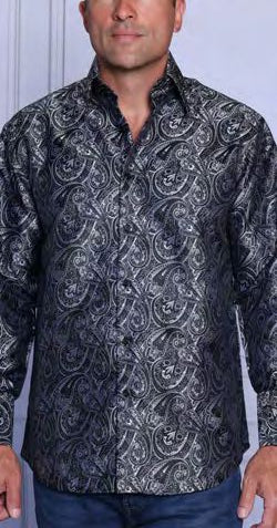 A man wearing the INSOMNIA MZT-210 Woven Satin Black Shirt by Insomnia, featuring long sleeves, silver paisley pattern, and French cuffs, stands against a light-colored background.