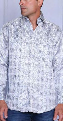 A man stands against a light background in blue jeans and the Insomnia INSOMNIA MZT-207 Woven Satin White Shirt by Insomnia, a long-sleeved, button-up shirt featuring french cuffs and a light-colored paisley pattern.