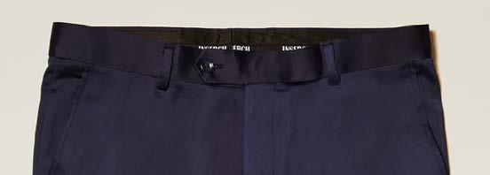 Close-up of the waistband and upper section of the Inserch Stretch Satin Pants P3901-00011 Navy by Inserch, featuring belt loops, a button closure, and a zipper fly.