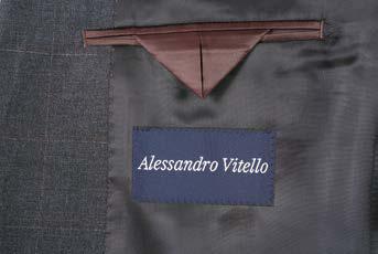 The Alessandro Vitello Classic Fit Suit 566-6, with a notch lapel in gray, is elegantly displayed on a mannequin alongside a white dress shirt and blue patterned tie.